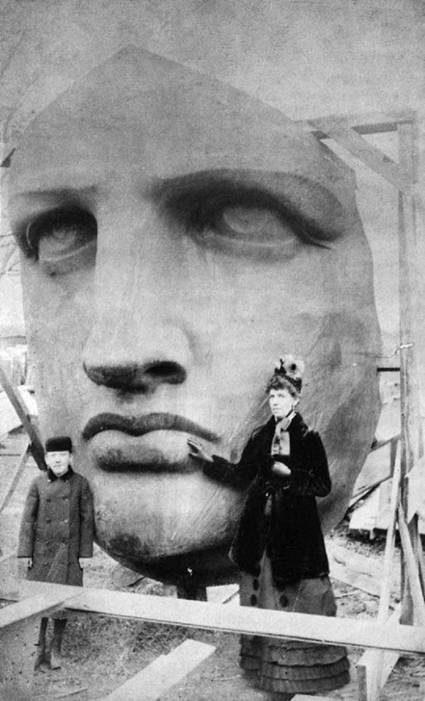 2.) People posing next to the Statue of Liberty's face as it was being un-packed.